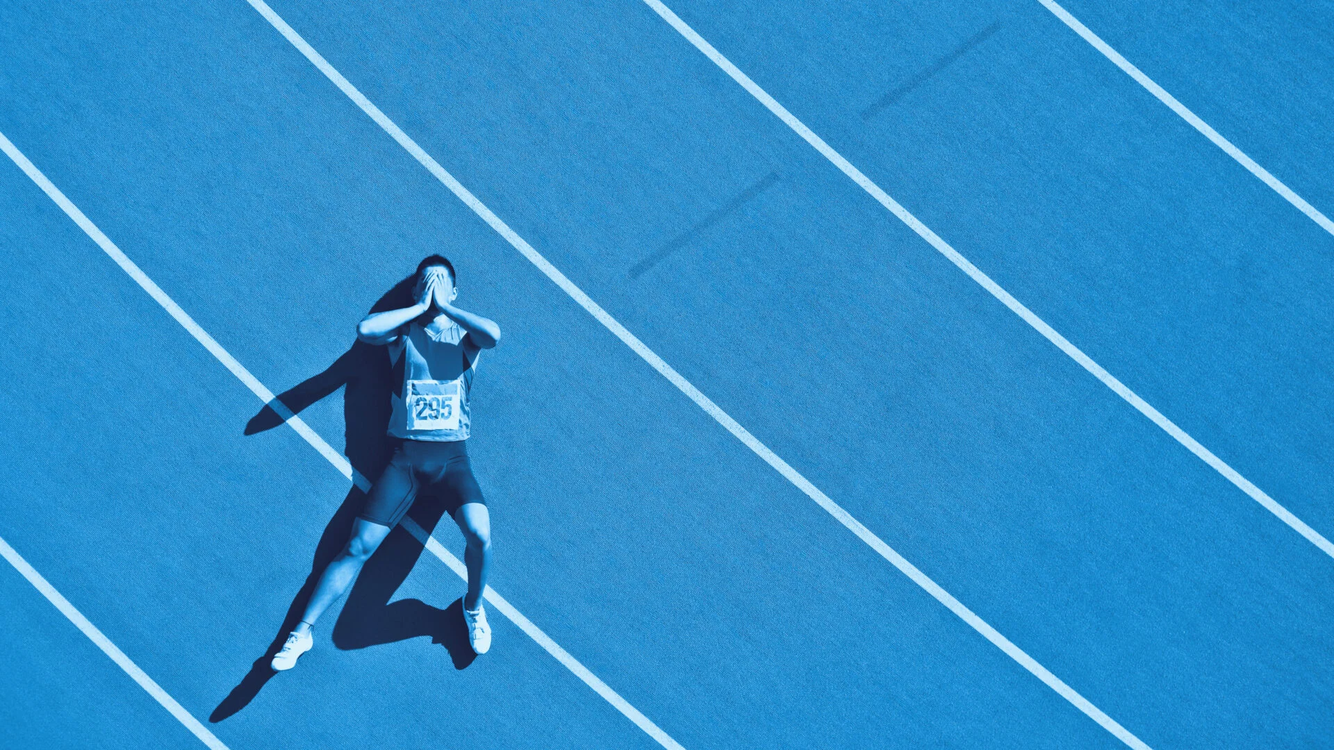 Athlete laying on the track